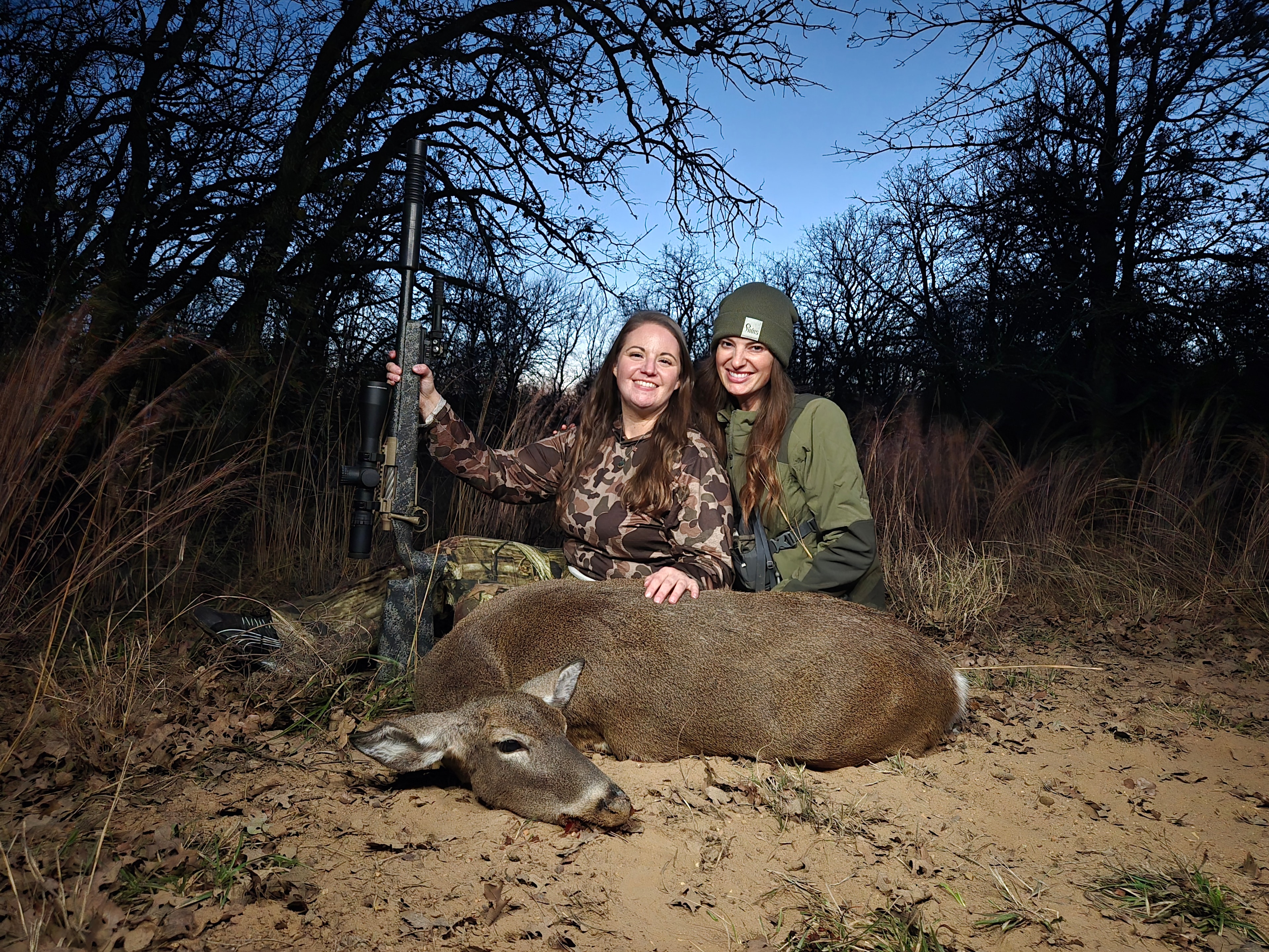 Two women hunters with a deer at Does Before Bros Hunt