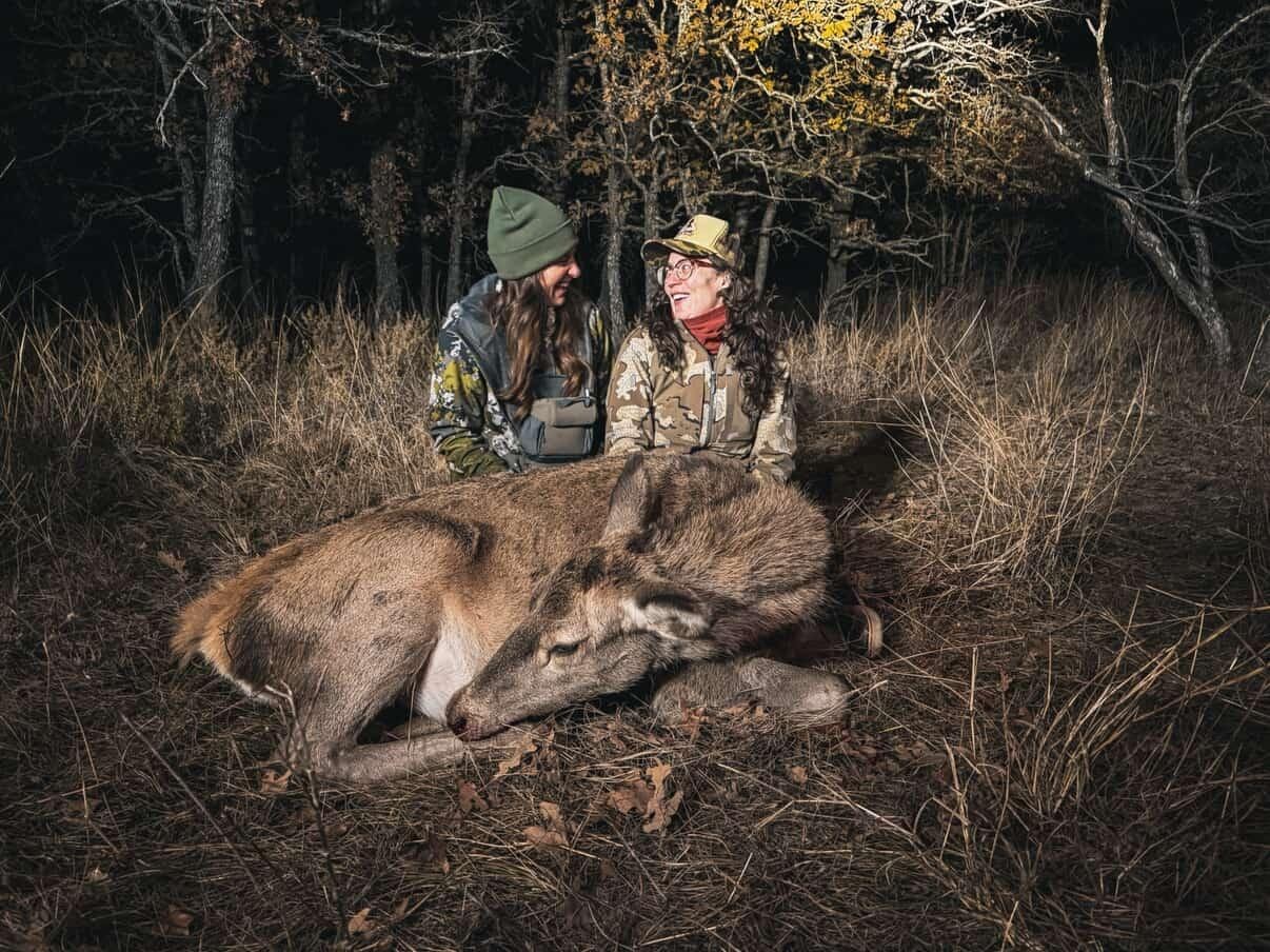 Women hunters with a hog at Does Before Bros Hunt