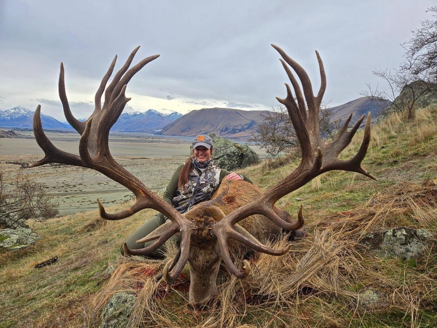 Kelsey Rae Slusser, Fort Worth Sables president, with elk in a mountain landscape